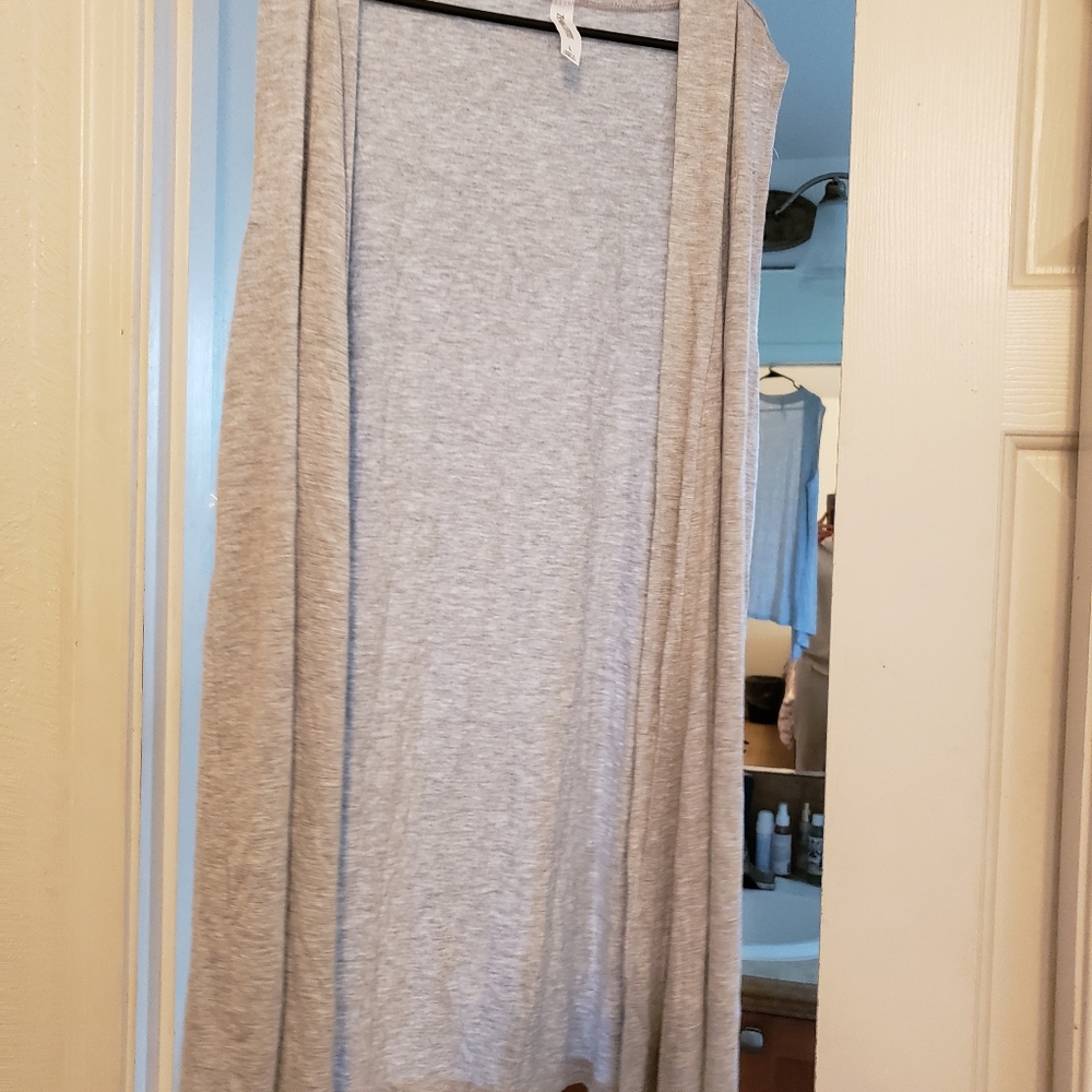 Sleeveless ultra lightweight and soft Cardigan. Like new.